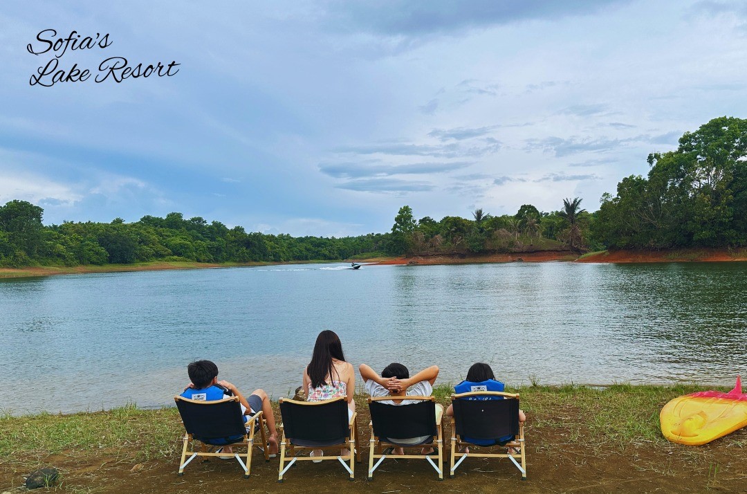 family relaxing lakeside