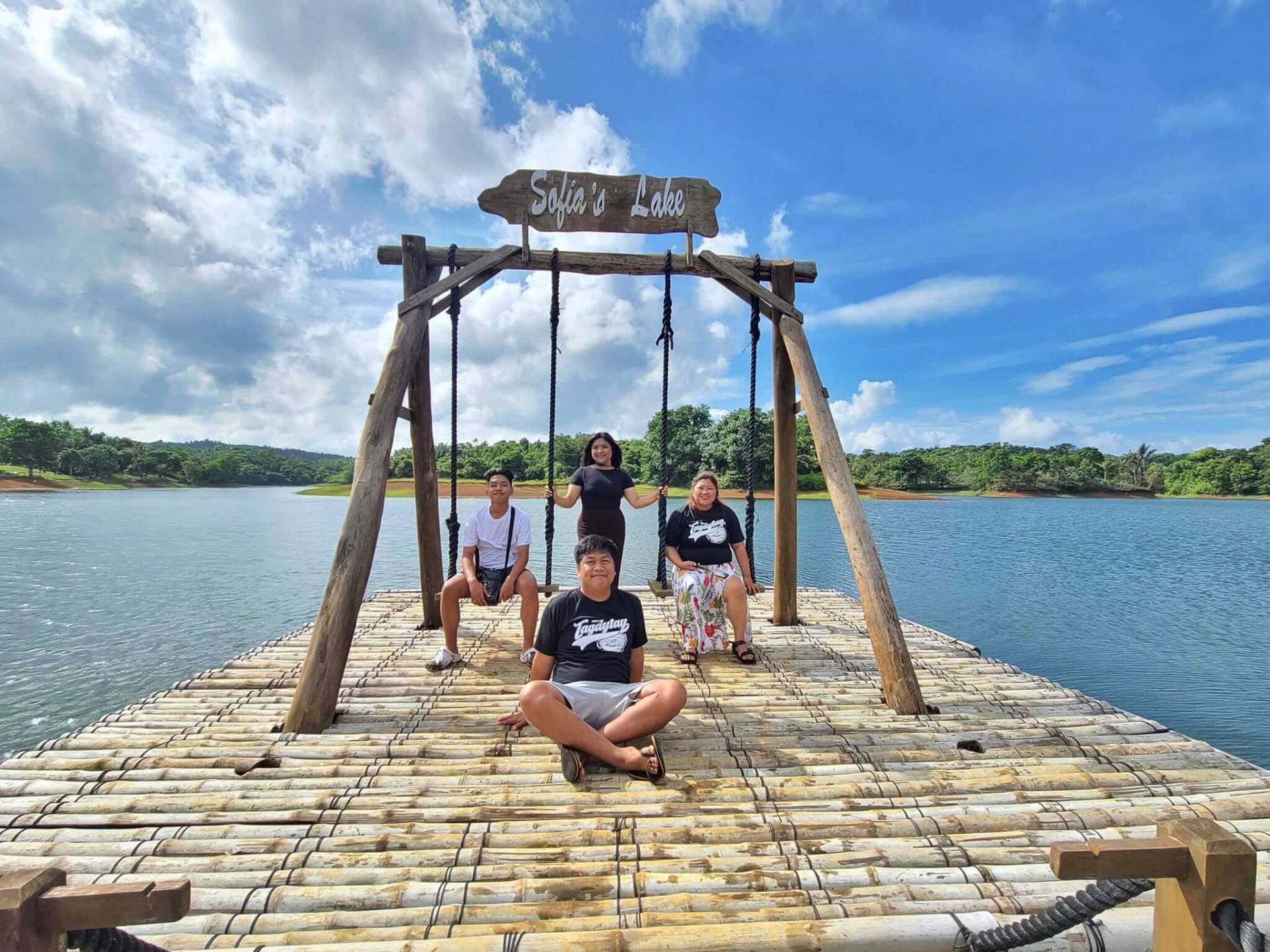 friends on lake swing